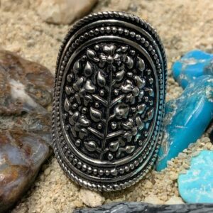 Detailed silver jewelry surrounded by stones