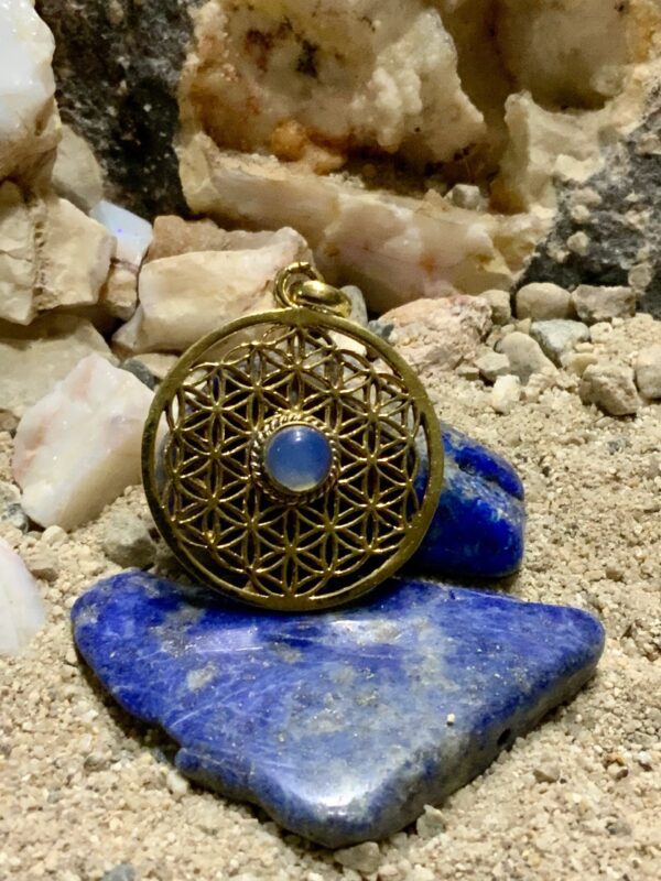 Intricate pendant with gemstone