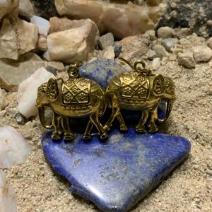 Brass elephant earrings on blue stone