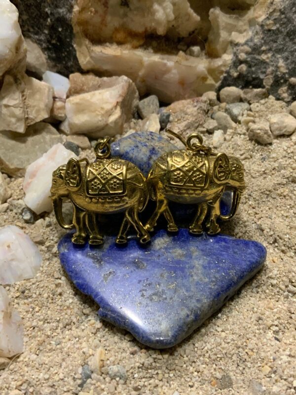 Brass elephant earrings on blue stone