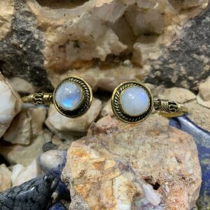 Moonstone bracelets on rocky background