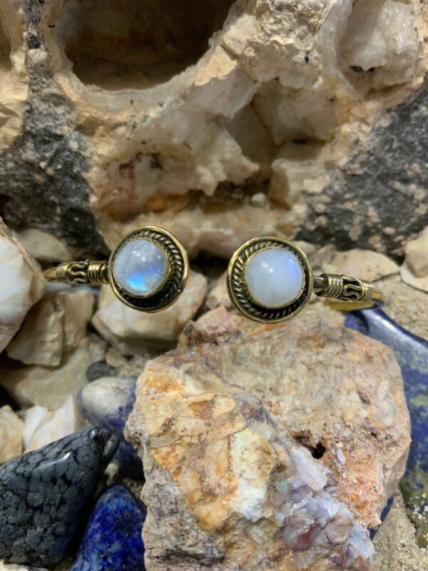 Moonstone bracelets on rocky background