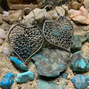 Artistic earrings with blue gemstone accents