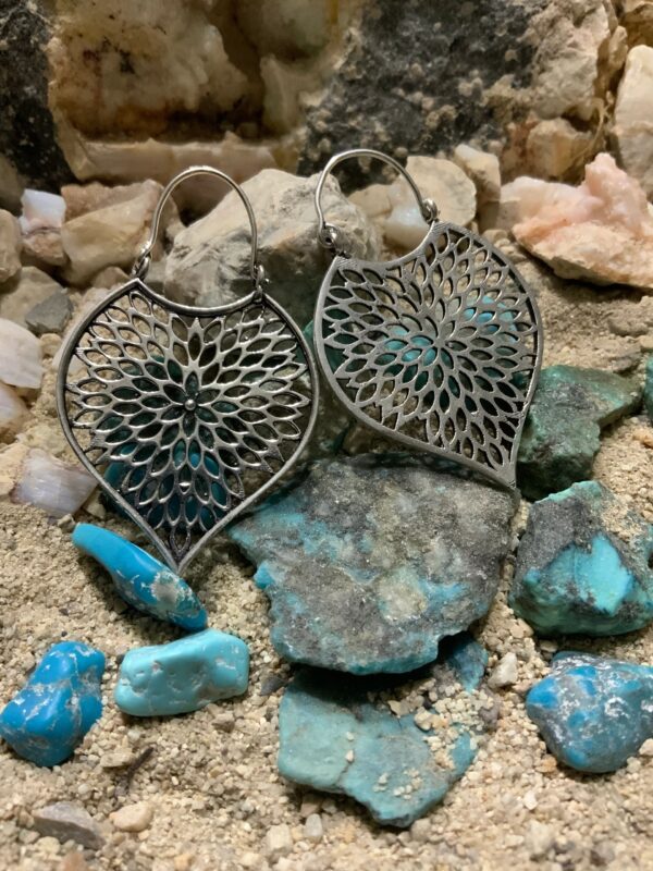 Artistic earrings with blue gemstone accents