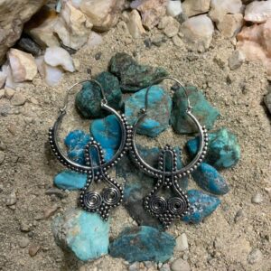 Silver earrings on turquoise stones