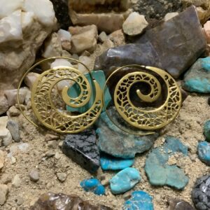Intricate earrings among colorful stones