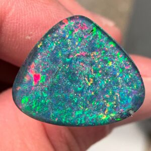 Triangular opal displaying iridescent hues
