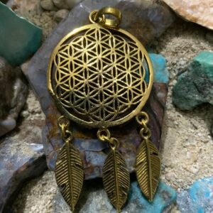 Intricate metal design with dangling feathers
