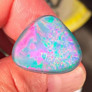 Vibrant opal stone with pink and green hues
