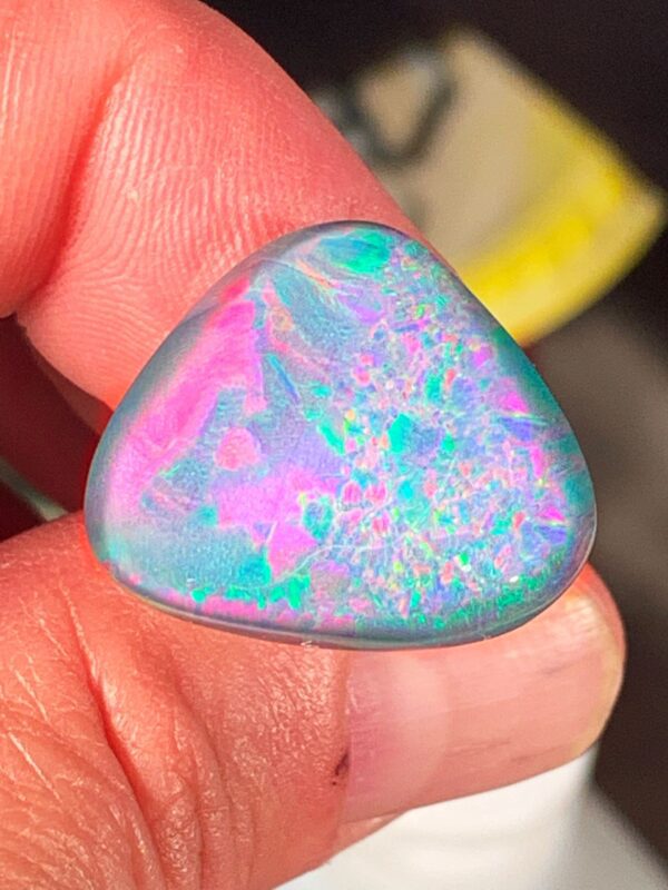 Vibrant opal stone with pink and green hues