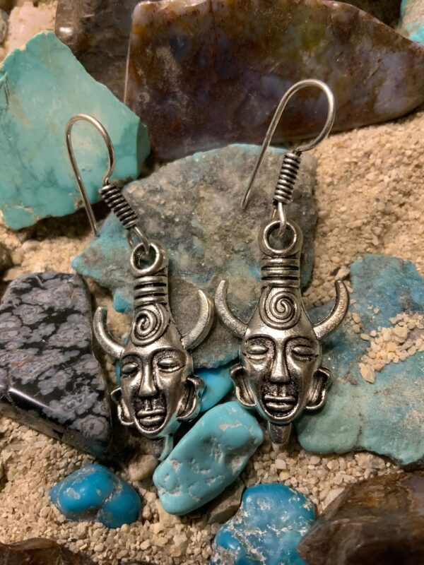 Tribal face earrings on turquoise stones
