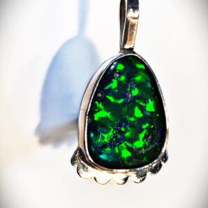 Teardrop-shaped green gemstone necklace charm