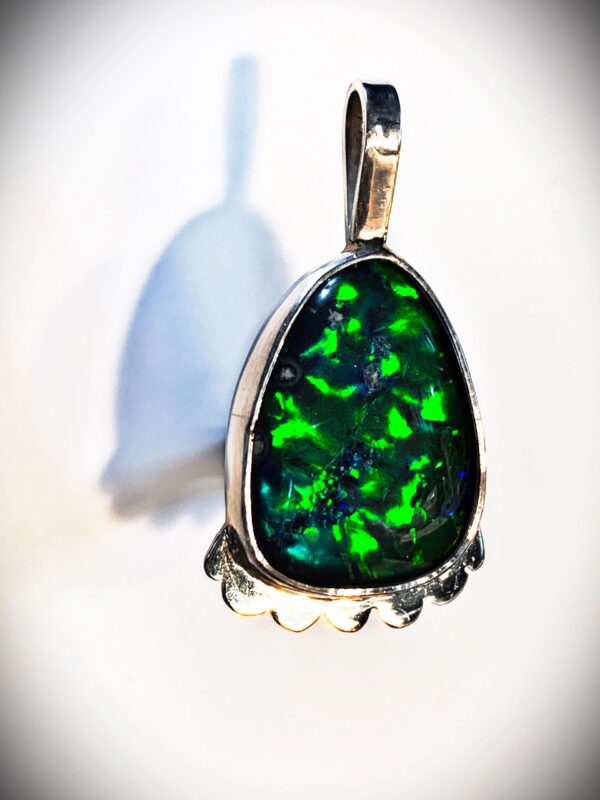 Teardrop-shaped green gemstone necklace charm