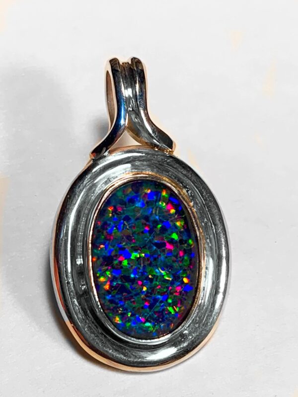 Vibrant opal pendant in silver setting
