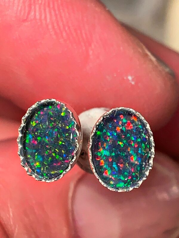 Iridescent opal earrings in silver setting