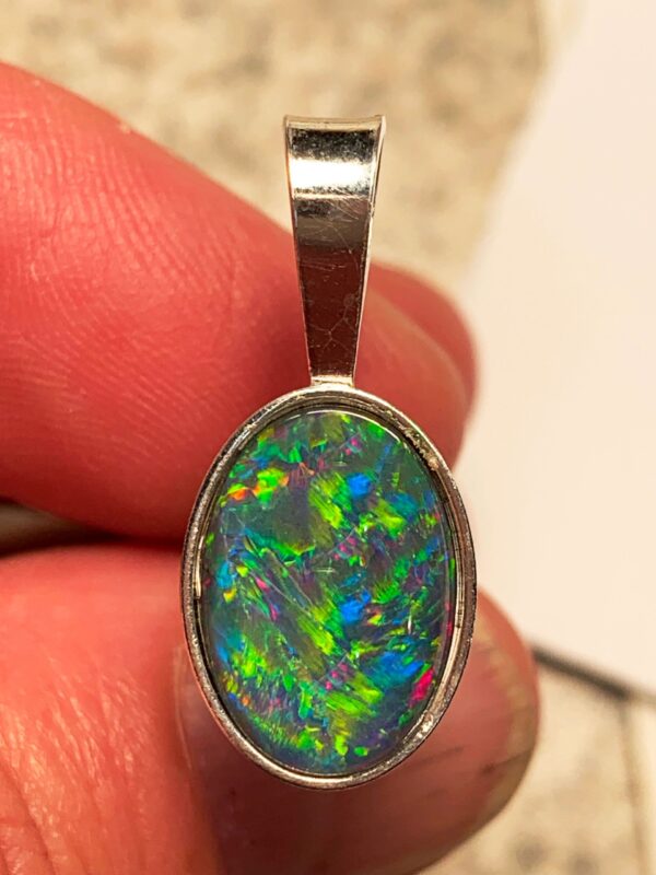 Close-up of opal gemstone pendant