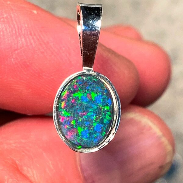 Opal gemstone pendant in silver setting