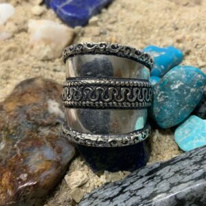 Intricate metal band with decorative pattern