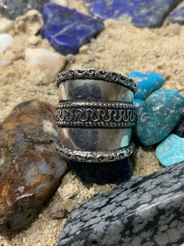Intricate metal band with decorative pattern