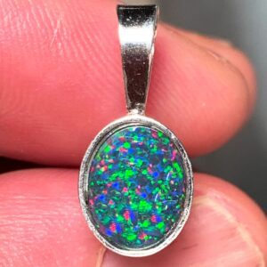 Silver pendant featuring opal gemstone