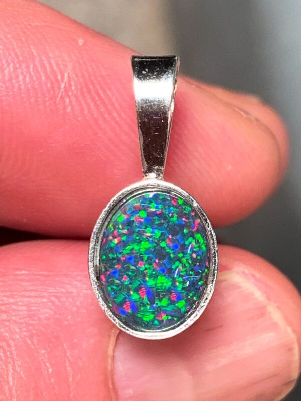 Silver pendant featuring opal gemstone