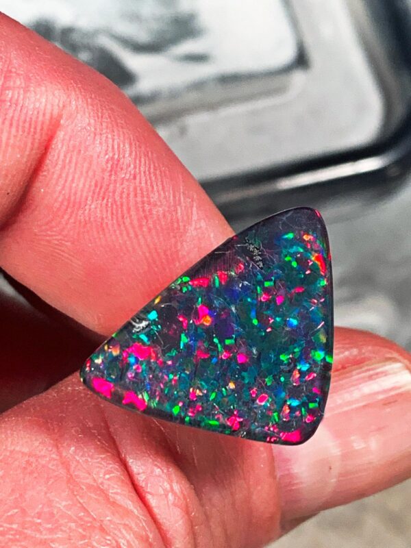 Iridescent triangular opal close-up