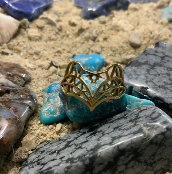 Ornate ring resting on gemstones