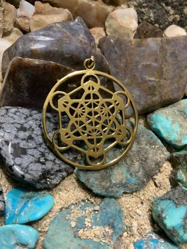 Intricate pendant with geometric design on rocks