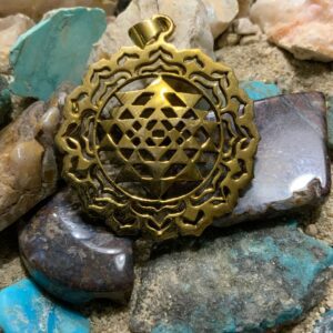 Geometric pendant resting on minerals