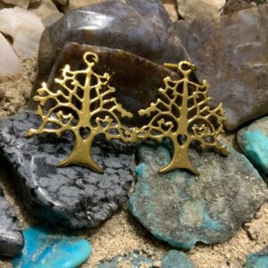 Golden earrings with intricate tree design