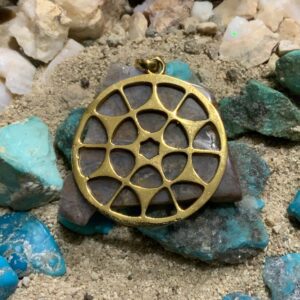 Golden pendant on turquoise stones