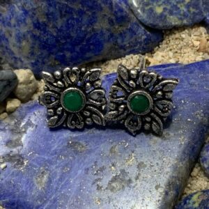 Ornate earrings with green center stones