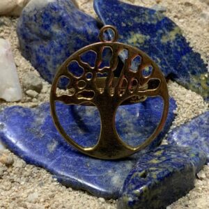 Tree of life pendant on blue stones.