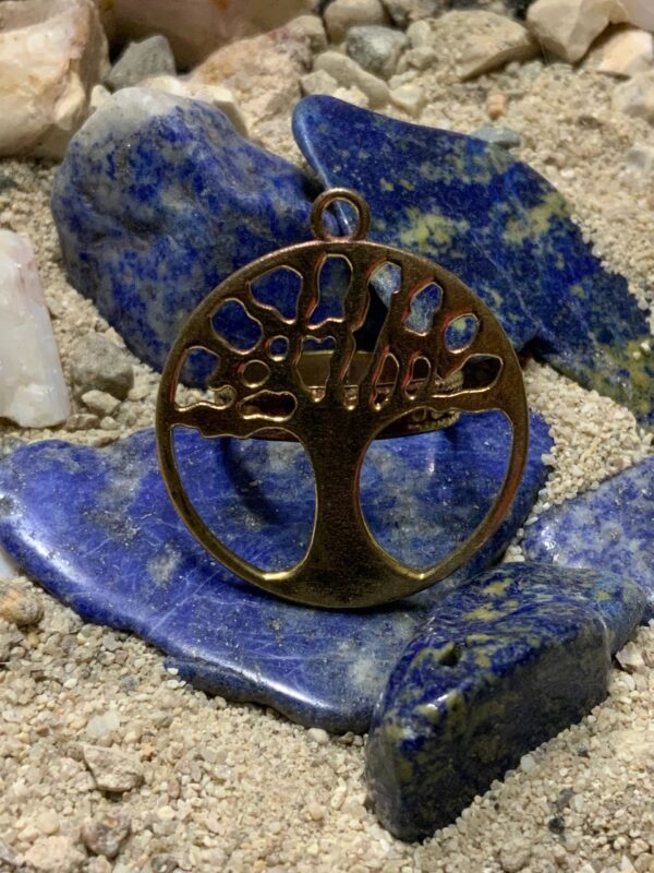Tree of life pendant on blue stones.