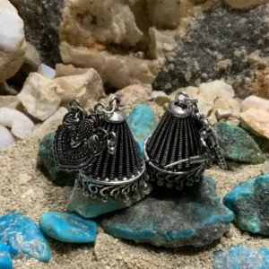 Intricate silver jewelry with turquoise accents