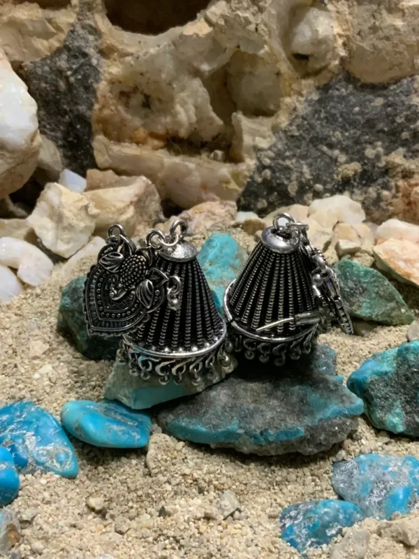 Intricate silver jewelry with turquoise accents