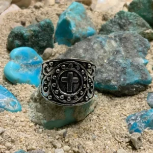 Ring with cross design on rocks