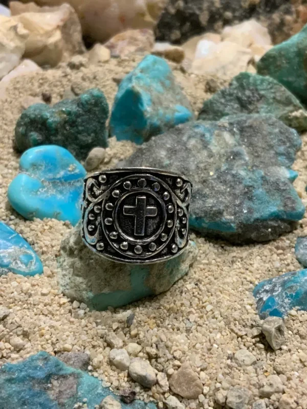 Ring with cross design on rocks
