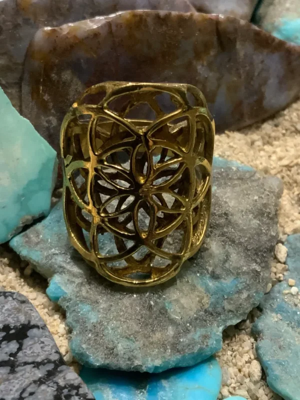 Gold ring with intricate design on stones