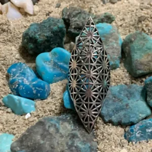 Decorative metal piece with turquoise rocks