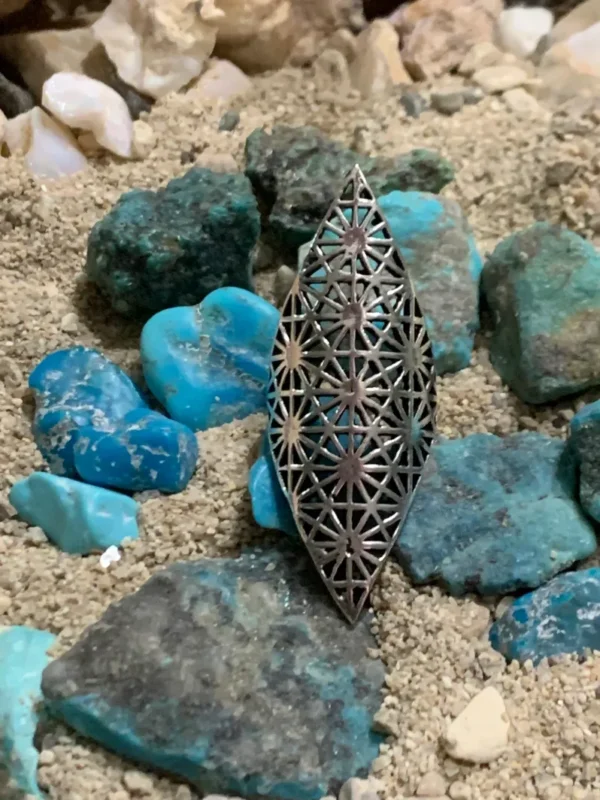 Decorative metal piece with turquoise rocks
